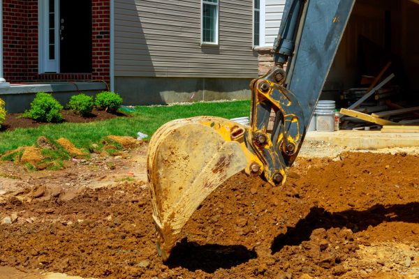 Large construction excavator on construction site with on sunny day